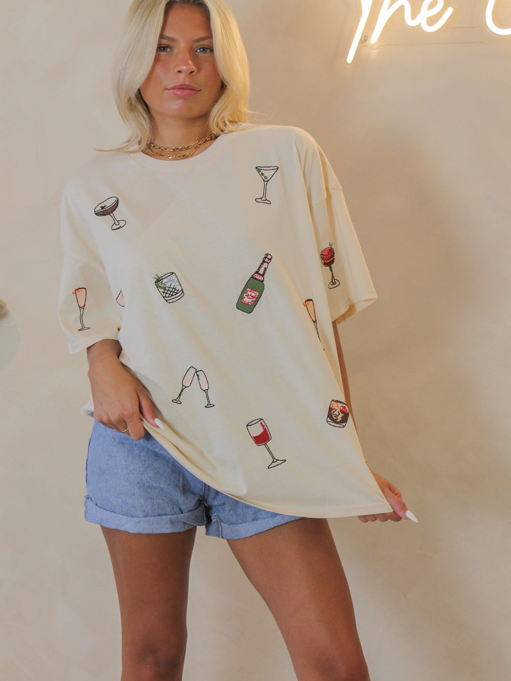 Cream oversized tee for women with embroidered cocktail graphics all over