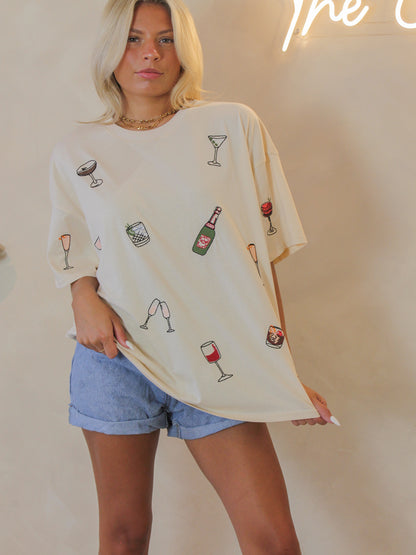 Cream oversized tee for women with embroidered cocktail graphics all over