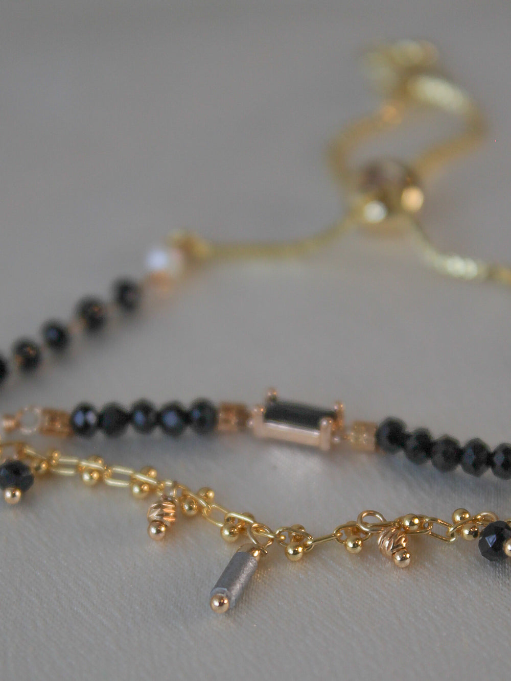 Gold and black beaded bracelets
