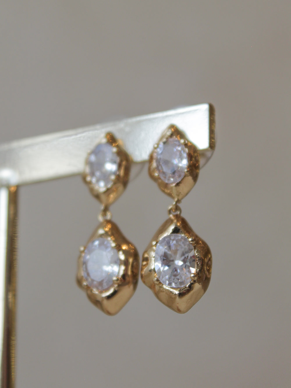 Gold, dangle earrings with clear gemstones 