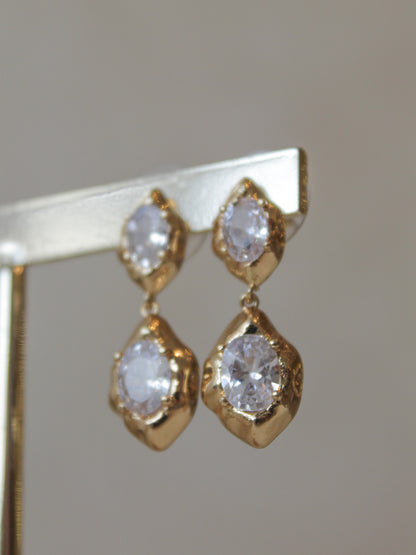 Gold, dangle earrings with clear gemstones 