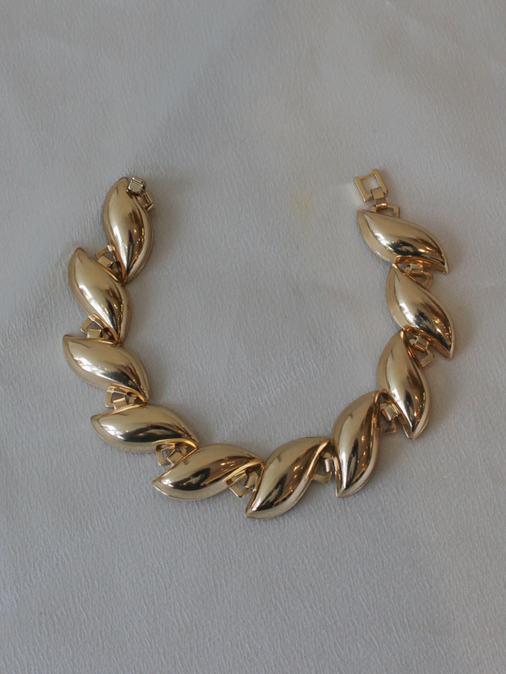 Gold statement bracelet with curved links 