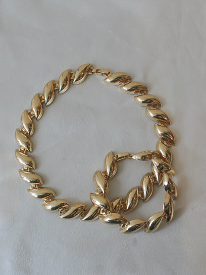 Matching gold statement necklace and bracelet with curved links 