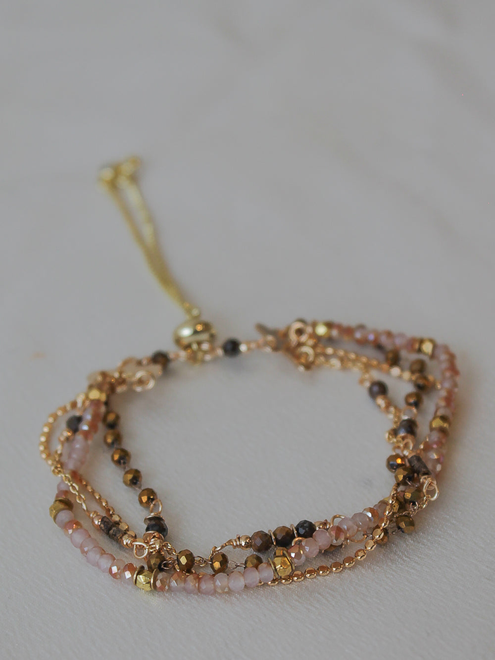 Multistrand beaded bracelet with gold accents 