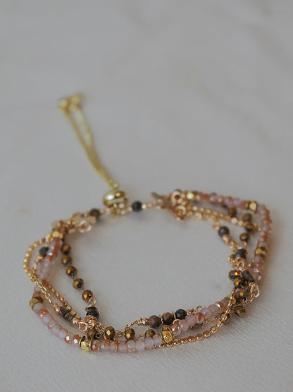 Multistrand beaded bracelet with gold accents 