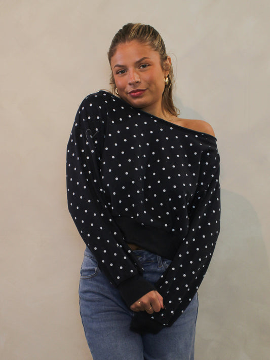Navy and white polka dot off-the-shoulder sweatshirt