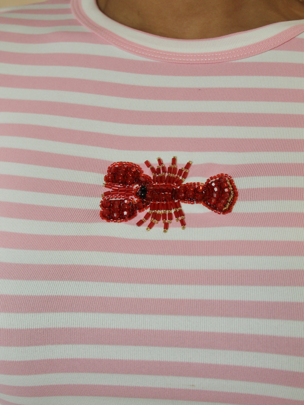 Beaded lobster embellishment on a pink and white striped shirt