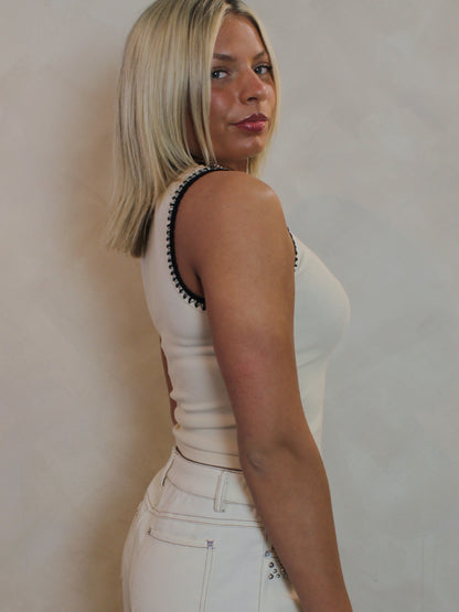 Cream tank top with black stitching 