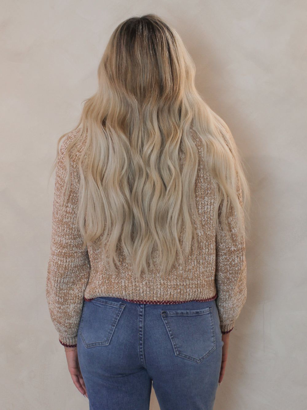 Woman wearing a cozy beige sweater for winter