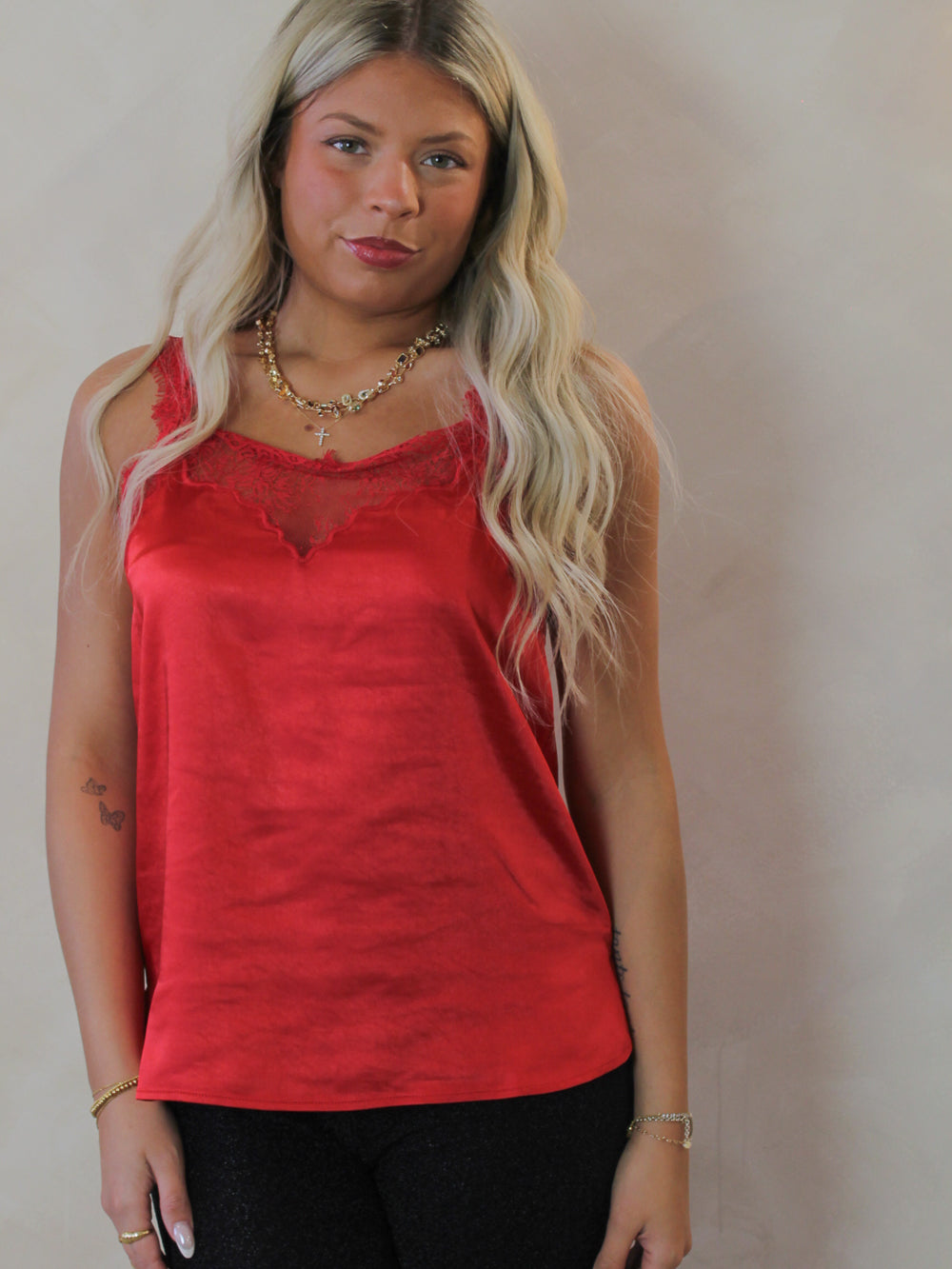 Model wearing a red lace tank for valentines day 