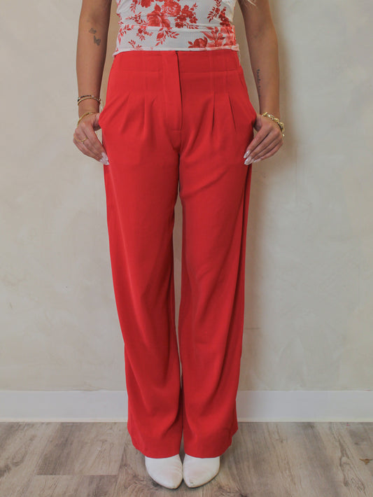 Woman wearing a pair of red trousers