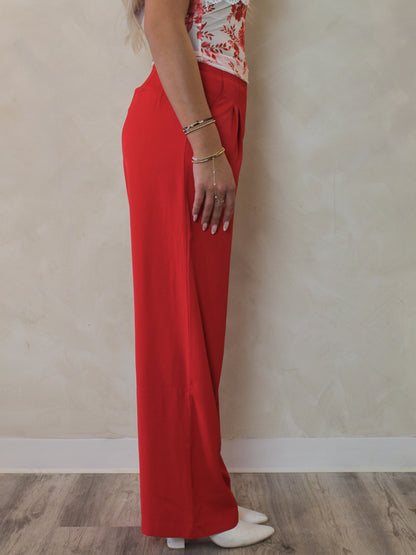 Side view of red wide leg trousers 