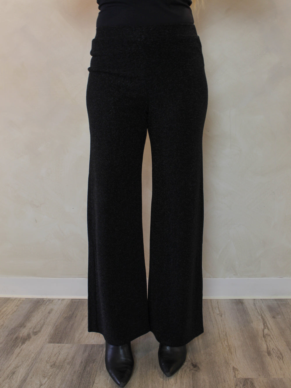 Front view of a pair of black pull on pants with shimmer detail 