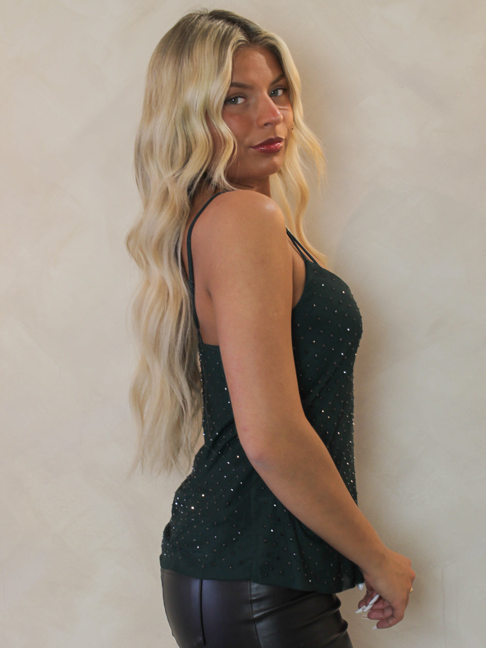 Rhinestone embellished tank in an emerald green 