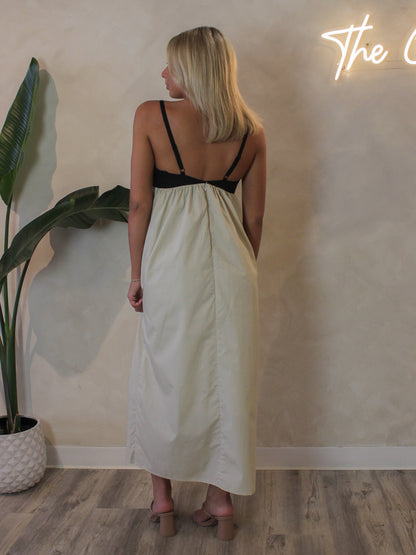 Back view of the Steve Madden Emmaline dress featuring adjustable straps and a tan skirt, perfect for summer special events