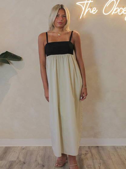Model wearing the Steve Madden black and tan Emmaline maxi dress for warm weather events