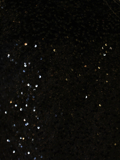 Close-up of black fabric with scattered sequins