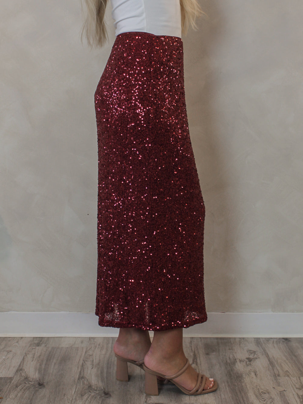 Side view of a red sequin skirt 