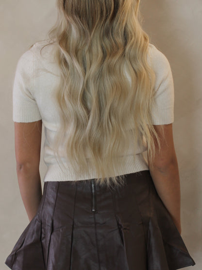 Ivory white sweater with 'Cheers' across the front 