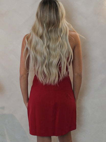 Woman wearing a red strapless short dress