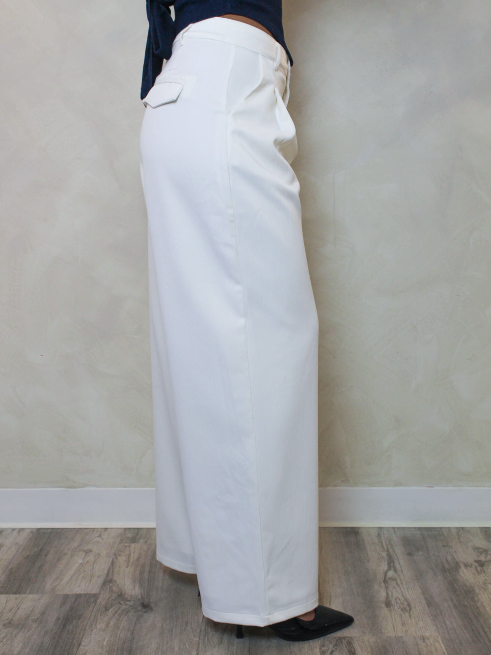 side view of women's white wide leg trouser