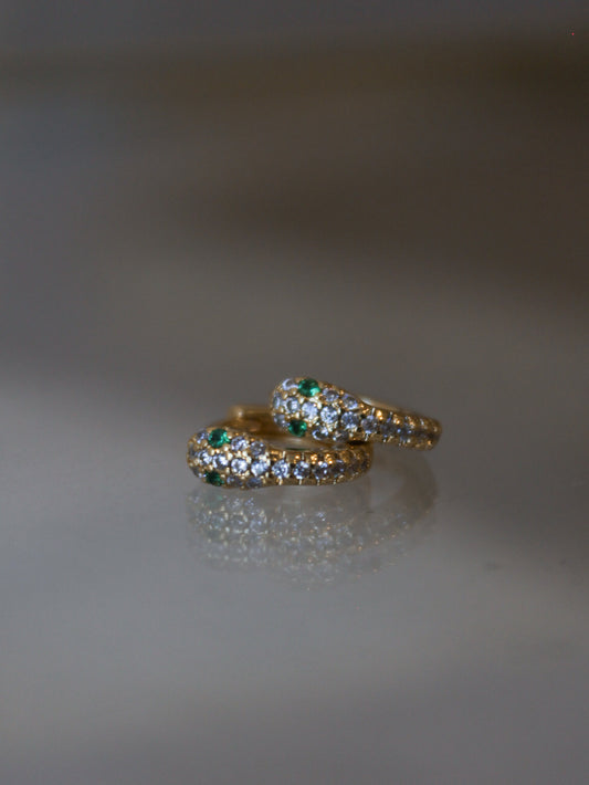 A pair of snake huggie earrings 