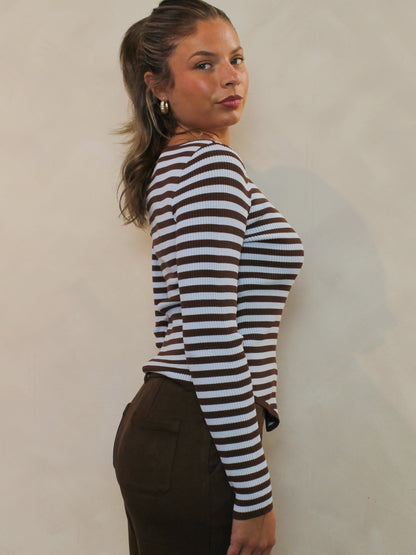 Side view of chocolate brown and blue striped top