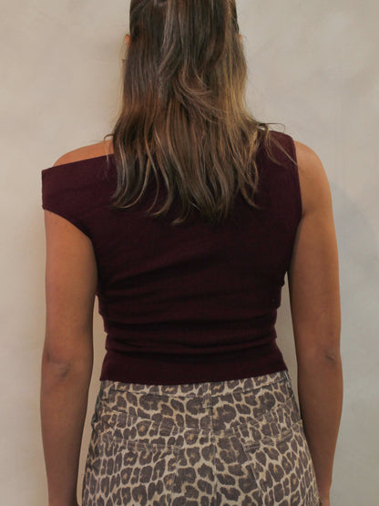 Back view of an off-the-shoulder short sleeve knit top in a burgundy color.