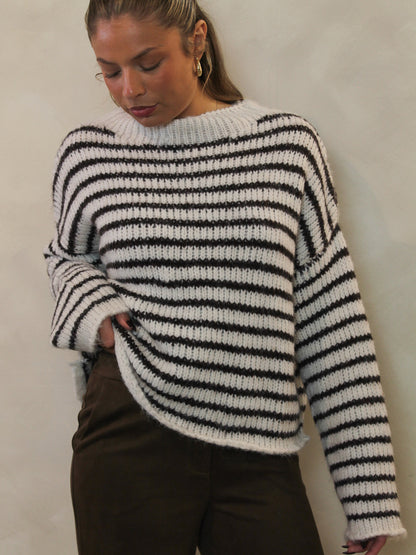 Chunky knit brown and white sweater.