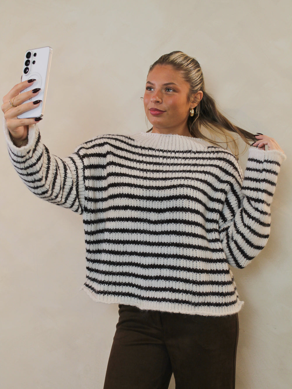 Chunky knit brown and white striped sweater.