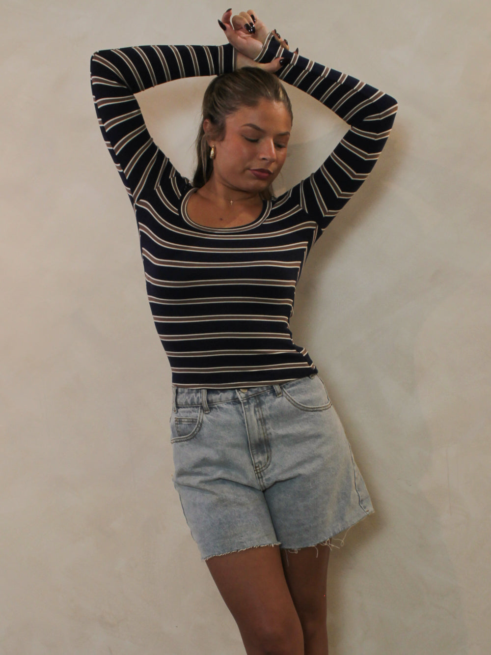 Navy and chocolate striped scoop neck top styled with denim shorts.