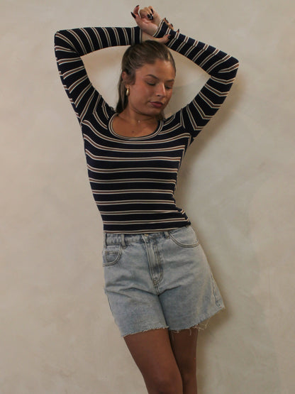 Navy and chocolate striped scoop neck top styled with denim shorts.