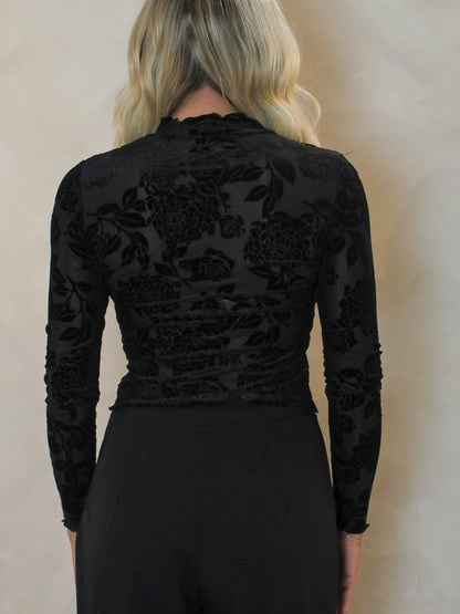 back view of a black, velvet, floral mesh top