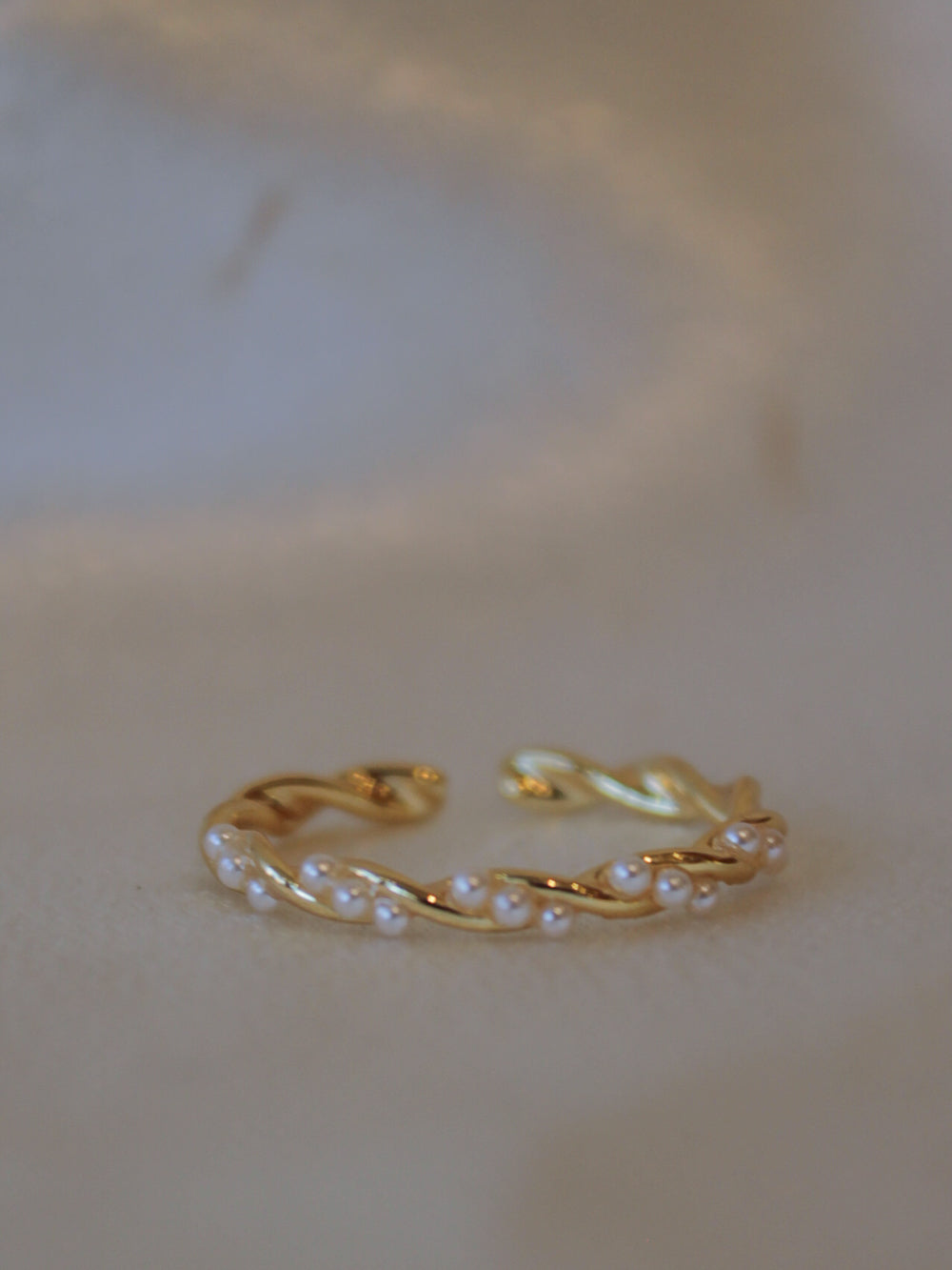 Dainty gold ring with pearl accents 