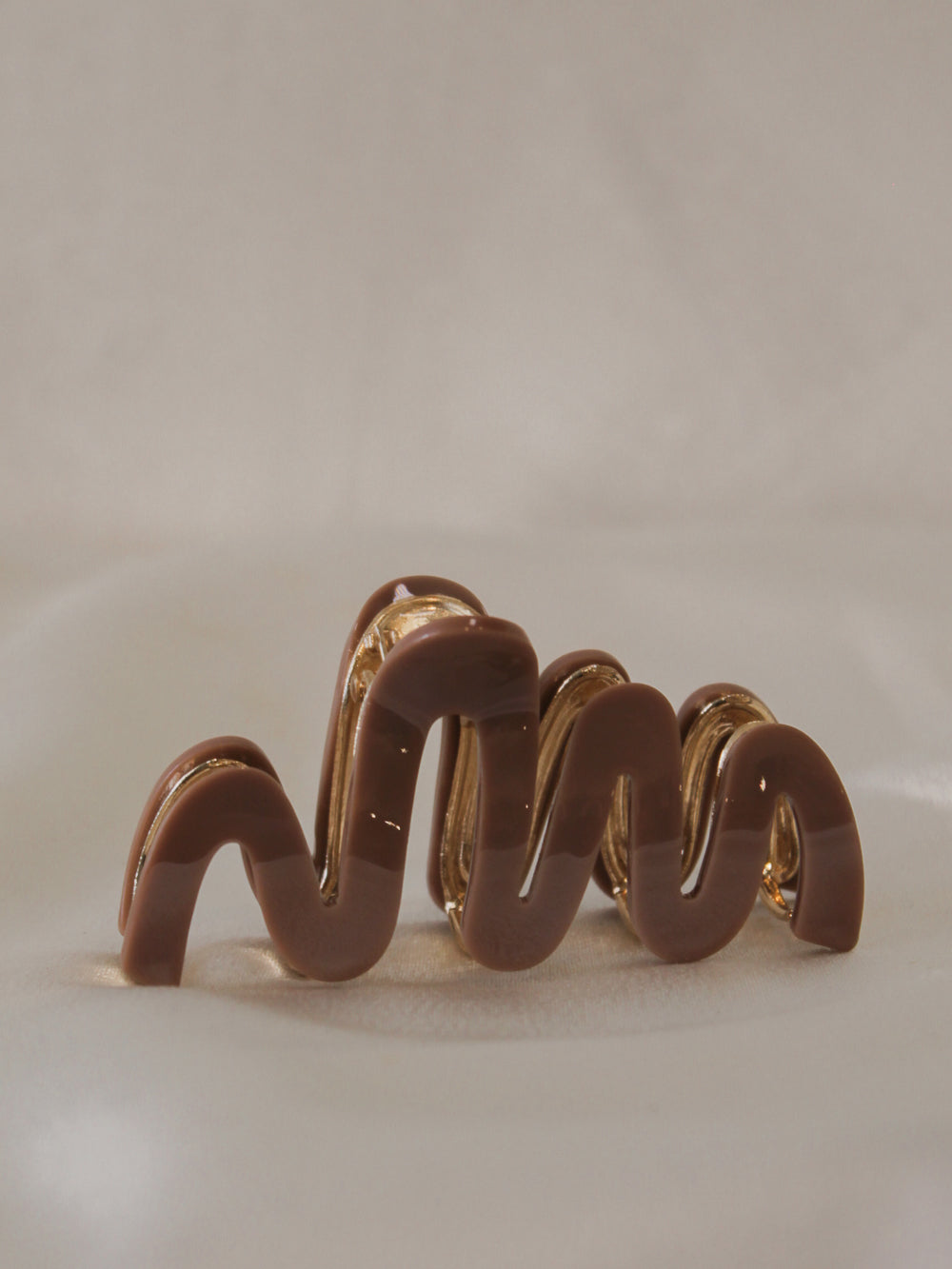chocolate brown claw clip with a wavy design  for women