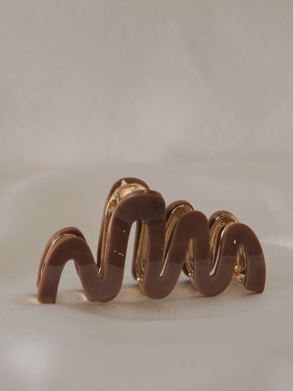 chocolate brown claw clip with a wavy design  for women