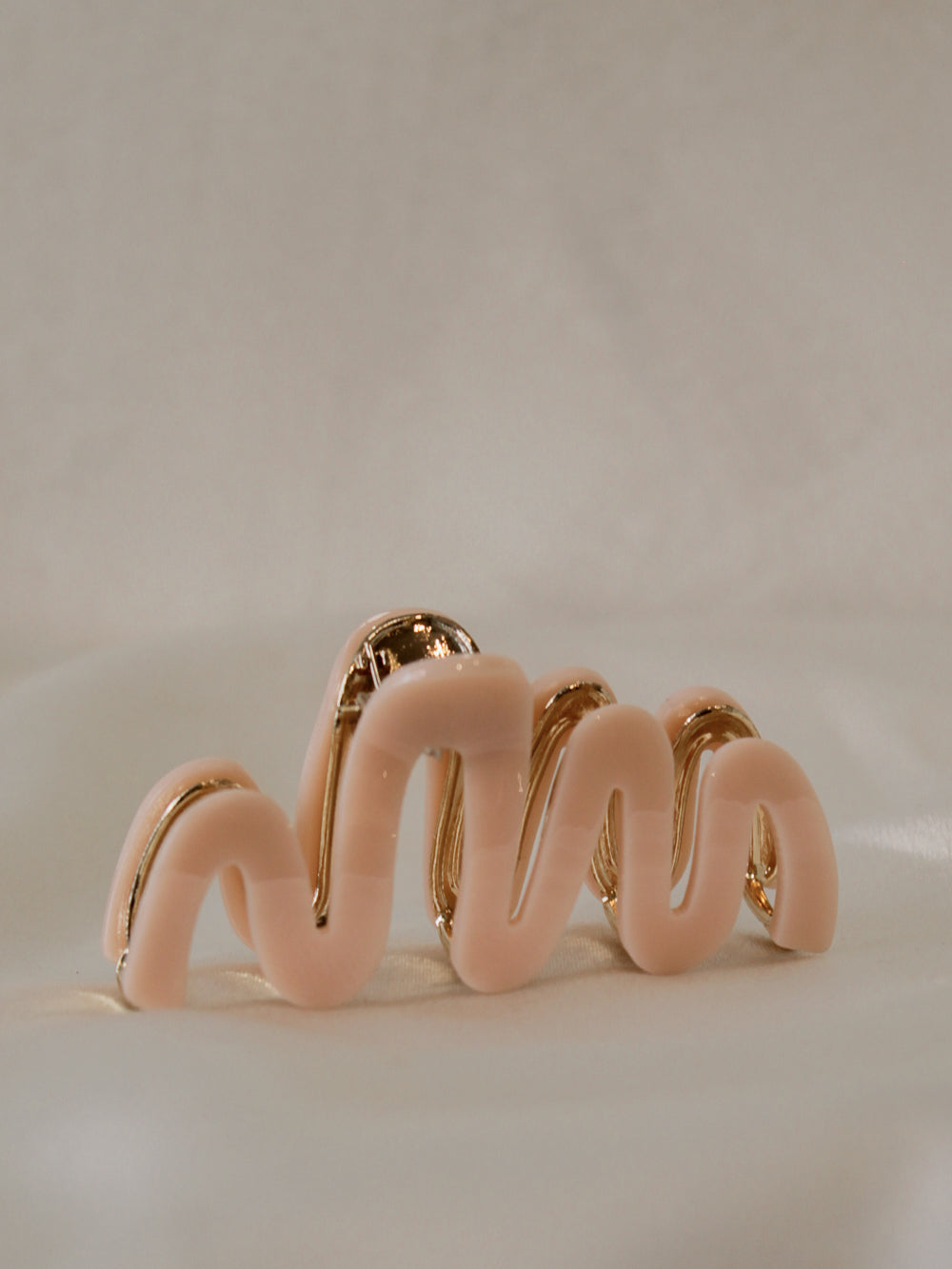 pink claw clip with a wavy design  for women