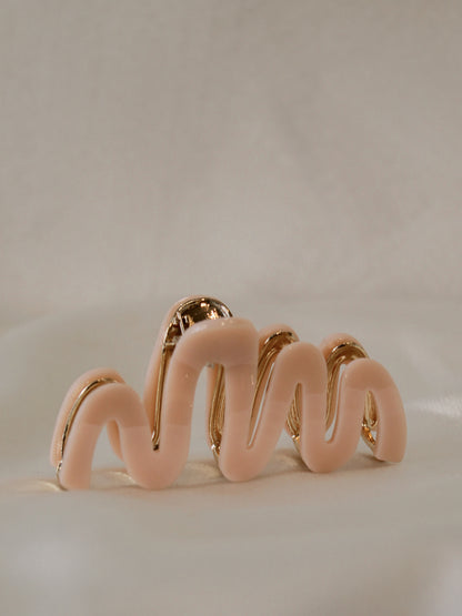 pink claw clip with a wavy design  for women