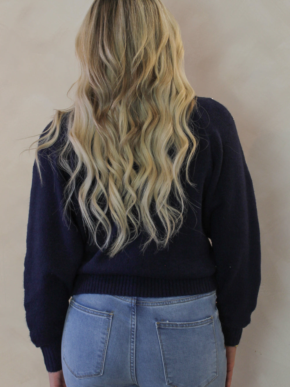 Model wearing a navy blue sweater for women 