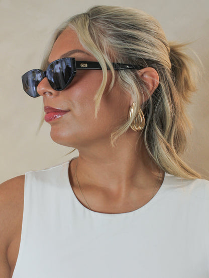 Side view of black, narrow cat eye sunglasses by WMP