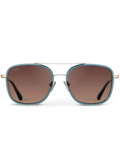 WMP Gia Aviator Sunglasses for women in a crystal blue color with brown lenses and gold hardware