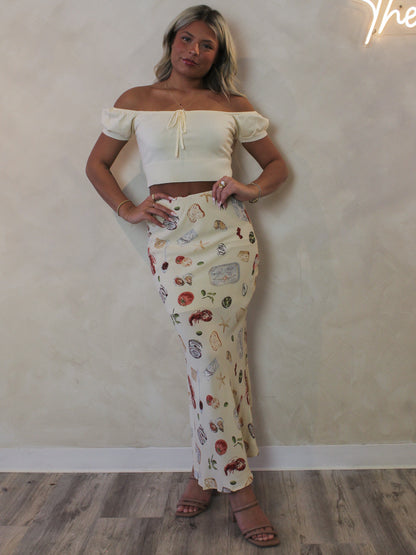 Model wearing a coastal print maxi skirt 