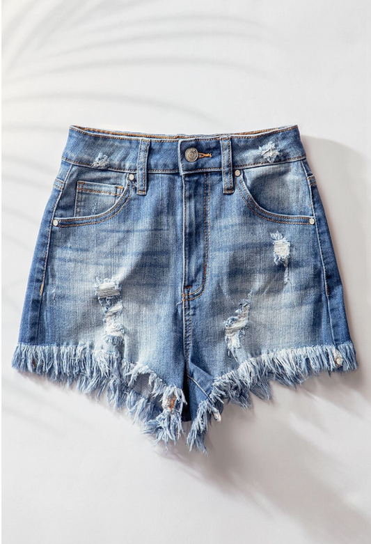 High Rise Distressed Denim Shorts in a Medium Wash